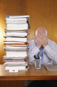 Businessman Swamped with Work